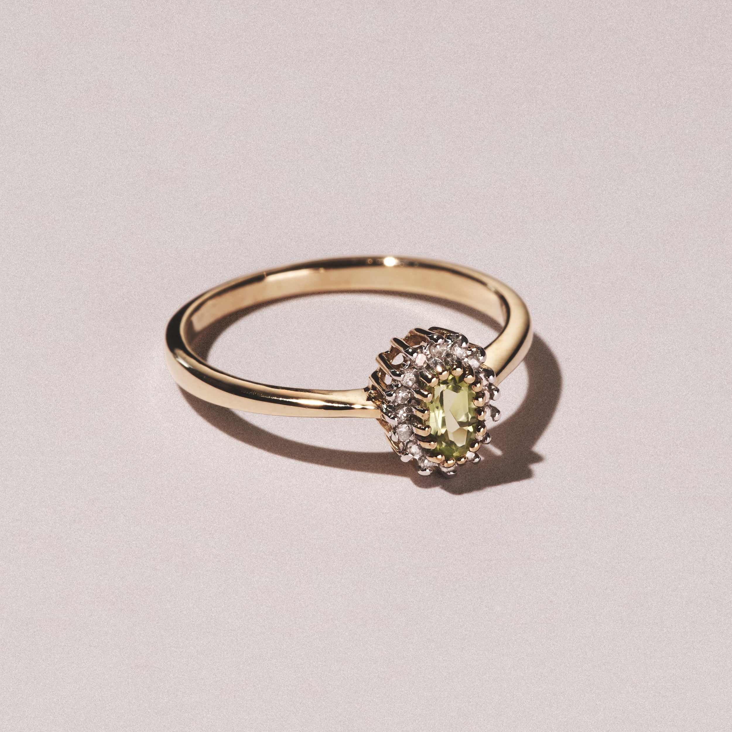 Peridot 6 x 4mm And Diamond 9K Yellow Gold Ring